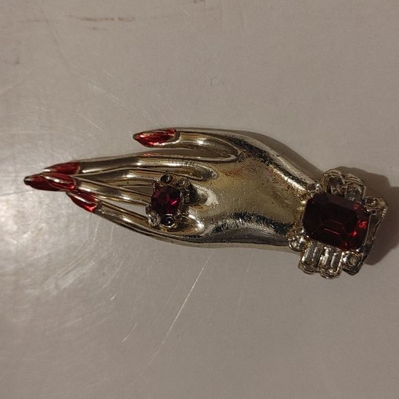 Jewelry - Hand with ring and polished nails brooch